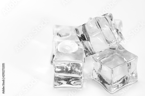 Wet ice cubes isolated on white background.Heap of melting ice on the plate.