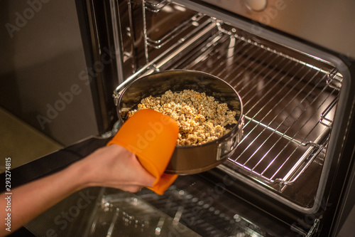 baking tray with granola in the oven