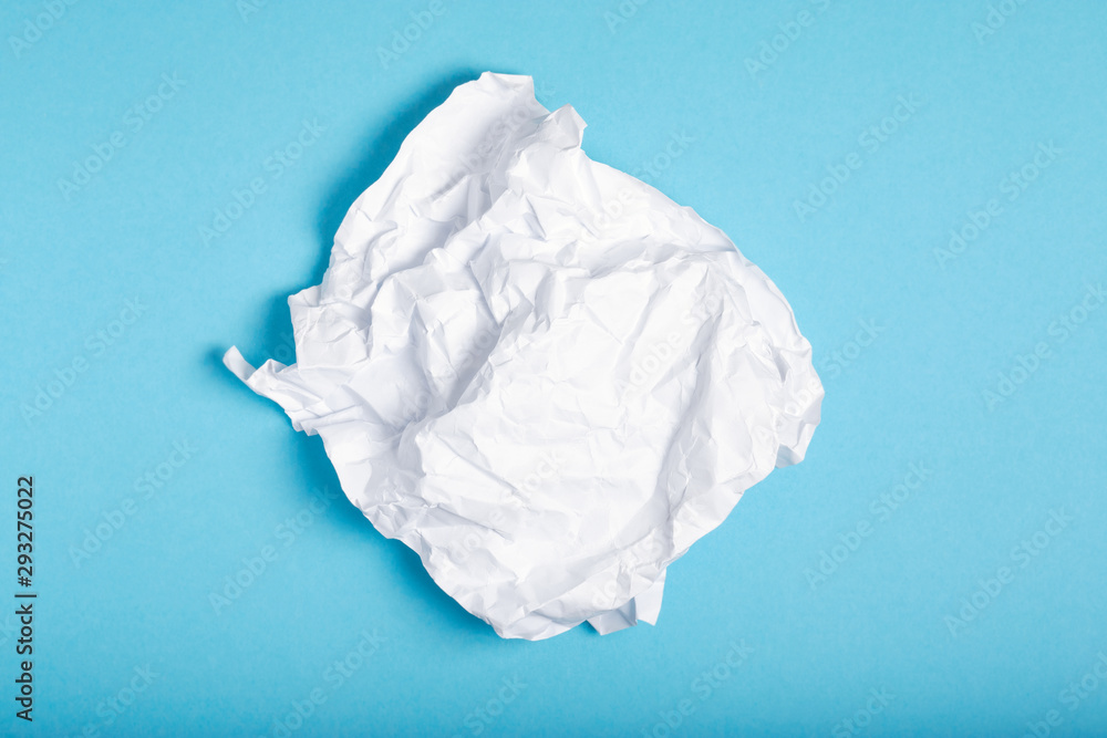 a piece of paper lying on a blue background sort of garbage