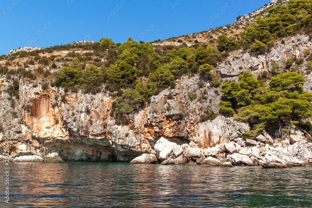 Rocky bay Malo Zarace island Hvar Croatia - EU. Holiday in Croatia. View from sailboat.