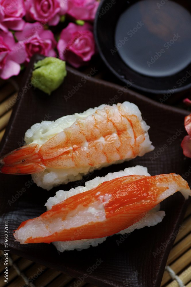 The seafood sushi serving with soy sauce and wasabi The seafood sushi serving with soy sauce and wasabi