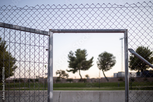 wire fence at sunset with unfocused background