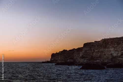 sea coast and the rocks above the sea during sunset. Beautiful sea landscape