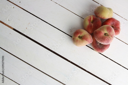 Paraguayan peach on wooden background photo