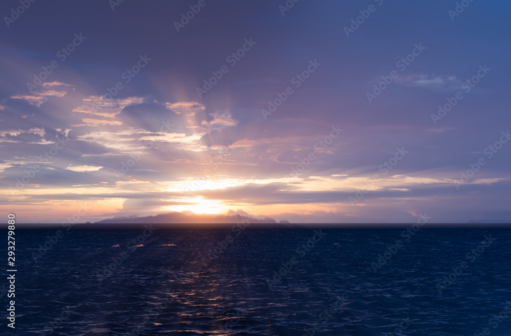 Beautiful beach sunset with big rain clouds and golden light sky  background