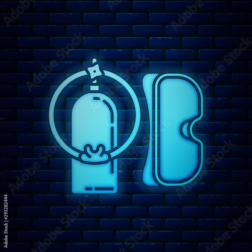 Glowing neon Diving mask and aqualung icon isolated on brick wall background. Oxygen tank for diver. Extreme sport. Sport equipment. Vector Illustration