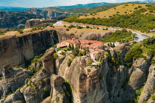 Kalampaka city, Greece aerial view drone on panorama of mountain range. View of the cliffs of Meteora and the monasteries of Meteora. Many ancient Orthodox monasteries summer