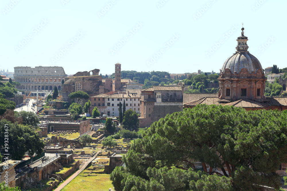 Skyline view of Rome with Forum buildings and Colosseum