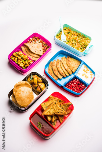 Fototapeta Naklejka Na Ścianę i Meble -  group of Lunch Box / Tiffin for Indian kids, showing variety or multiple option or combination of healthy food for your school going children
