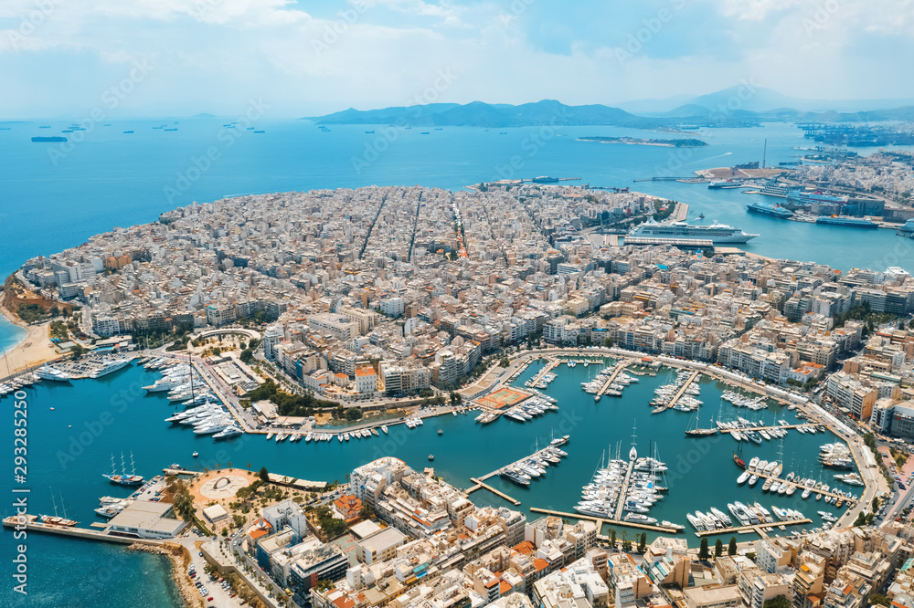 City Piraeus, Greece aerial view drone on panorama of buildings of residential and administrative buildings in summer on sunny day. Roof plan aerial view of the sea. Travel. Tourism