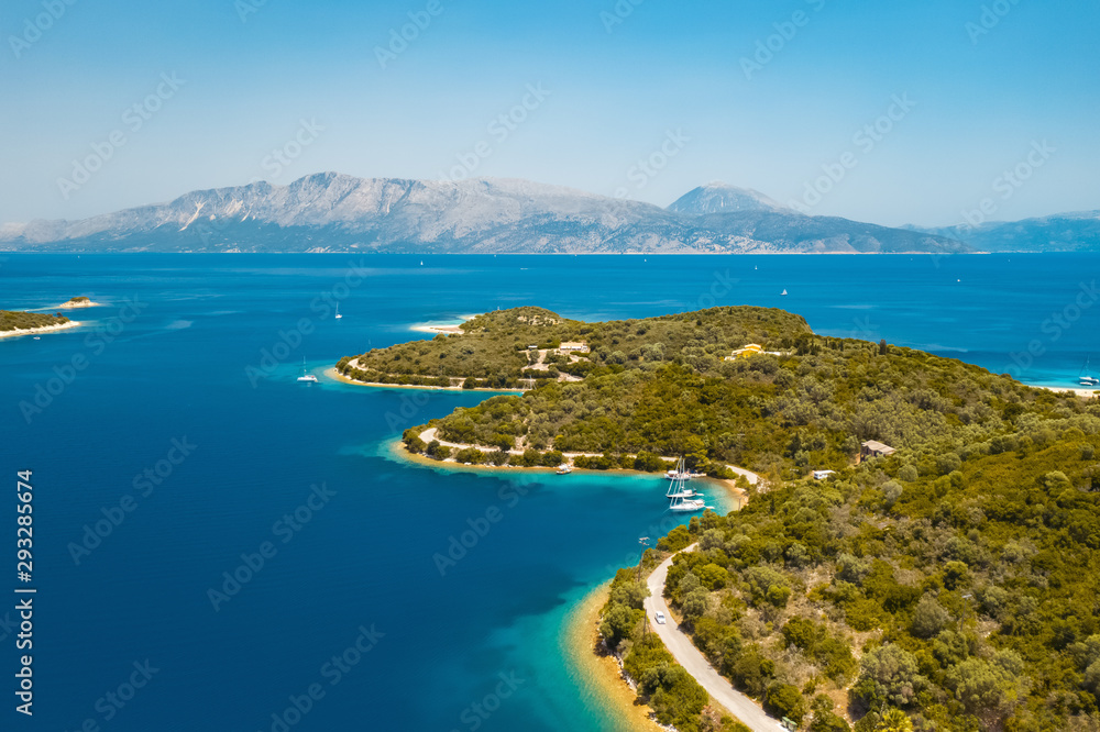 Aerial view from a drone on a panorama of the blue sea, picturesque islands and mountains in Greece, in summer on a sunny day. Beautiful coastline of the resort town. Tourism Aerial view from a drone on a panorama of the blue sea, picturesque islands and mountains in Greece, in summer on a sunny day. Beautiful coastline of the resort town. Tourism