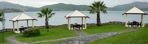 Summer pavilions in the garden with relaxing lake view. Exterior design