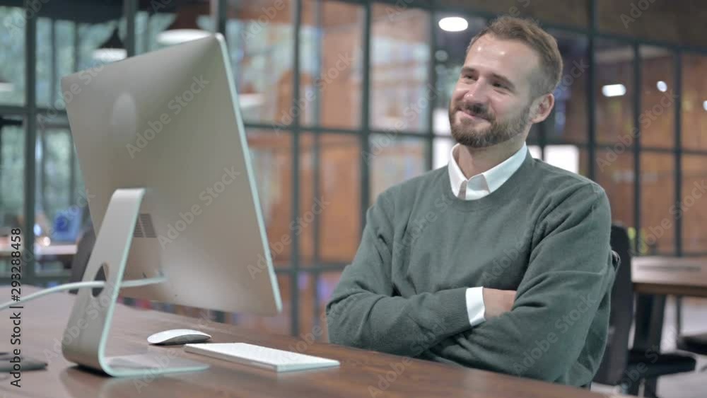 Working Man Smiling and doing Video Chat on Computer Working Man Smiling and doing Video Chat on Computer