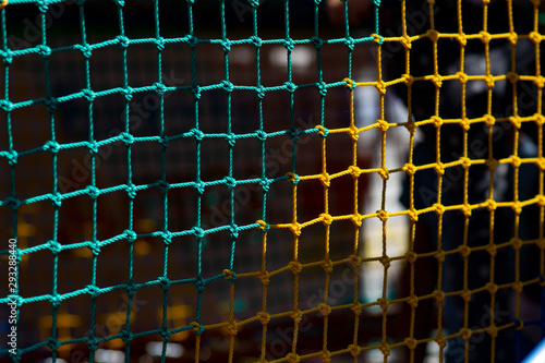 Colored rope net with a blurred background in the background.