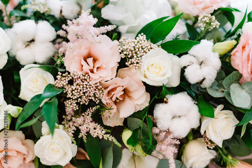 Original wedding floristics. The wedding flower bouquet is supplemented with natural twigs, berries and greenery. photo