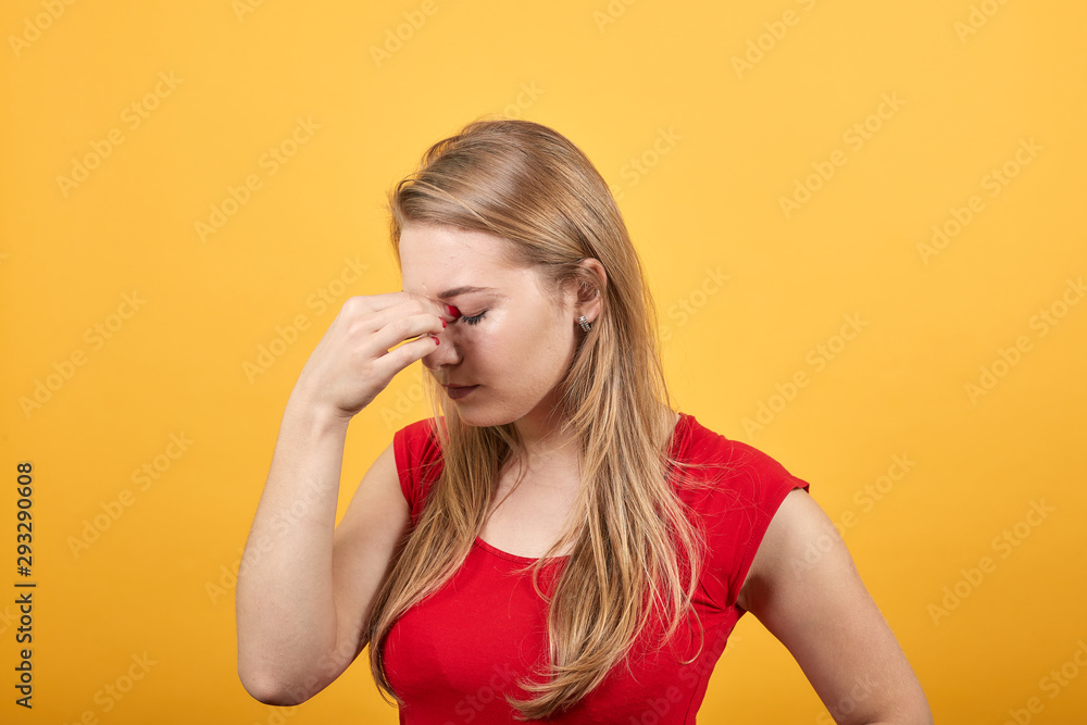 young blonde girl in red t-shirt over isolated orange background shows emotions young blonde girl in red t-shirt over isolated orange background shows emotions