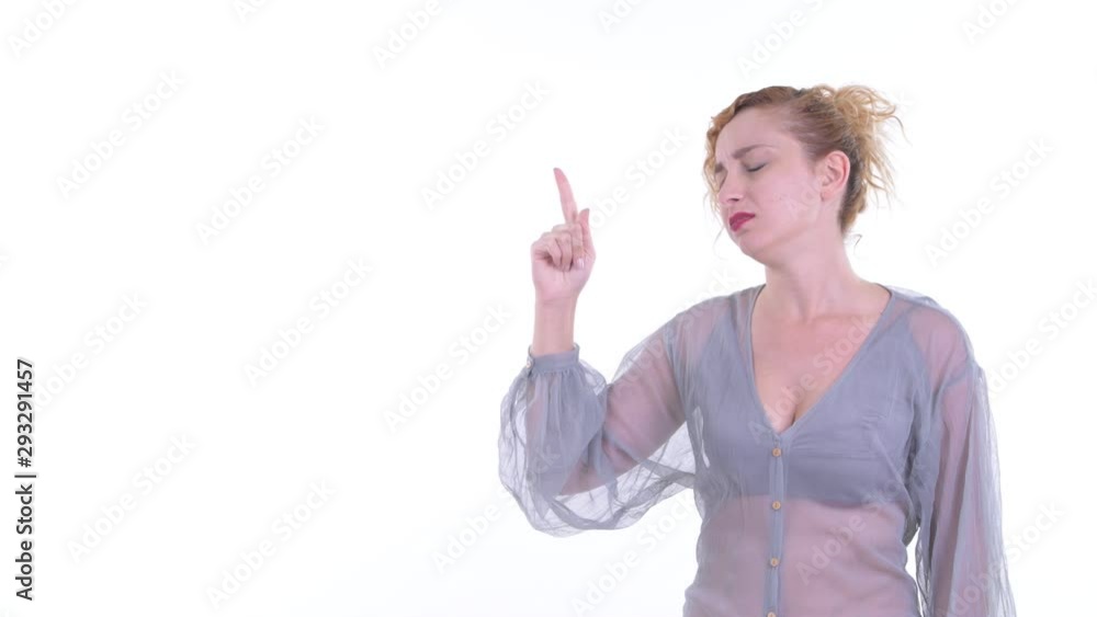 Stressed blonde woman pointing up and looking upset Stressed blonde woman pointing up and looking upset