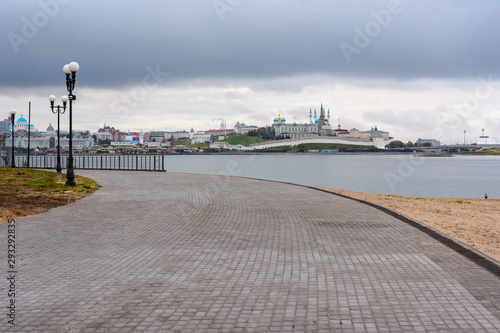 View of the Kazan Kremlin with Presidential Palace  Annunciation Cathedral  Soyembika Tower  Qolsharif Mosque from the embankment near the center family and marriage with the bright blue sky.