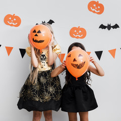 Front view little girls in witch costume for halloween