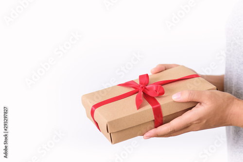 Fototapeta Naklejka Na Ścianę i Meble -  Gift box in hand for giving on white background