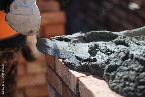 Wallpaper Mural Brick wall contruction with mason hands Torontodigital.ca