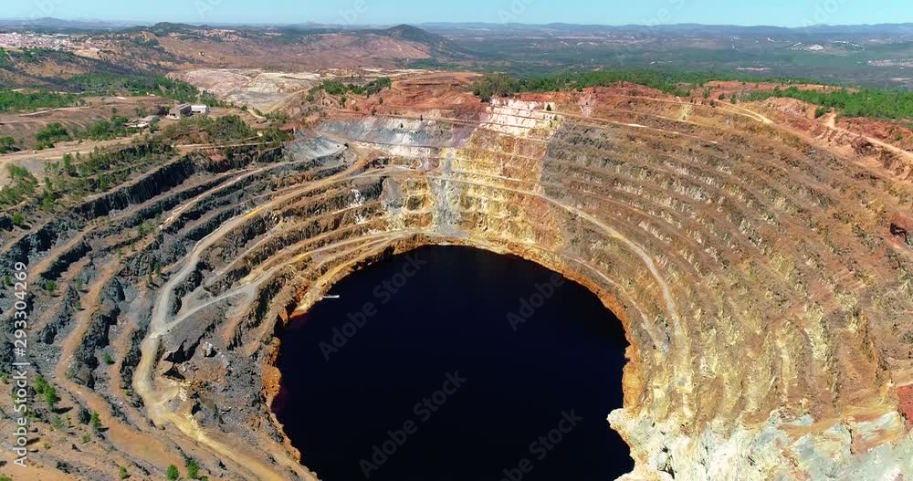 Aerial view with a drone of a mine on a hill near the Rio Tinto in Spain. This is ore extraction in the production industry - industry and landscape concept Aerial view with a drone of a mine on a hill near the Rio Tinto in Spain. This is ore extraction in the production industry - industry and landscape concept