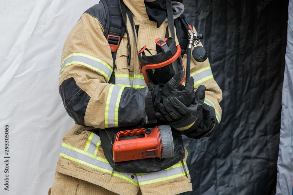 Fototapeta premium Firefighter ready for action he is ready for deployment