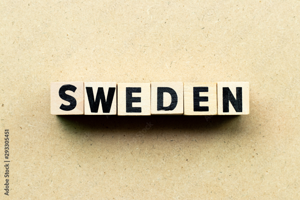 Obraz premium Letter block in word Sweden on wood background