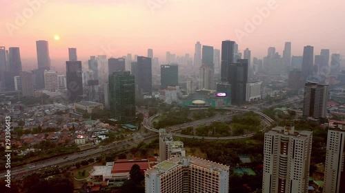 Aerial view of semanggi intersection in Jakarta while in high pollution air covering the city. DOLLY motion. photo