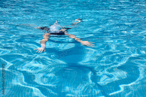 woman swimming in a pool