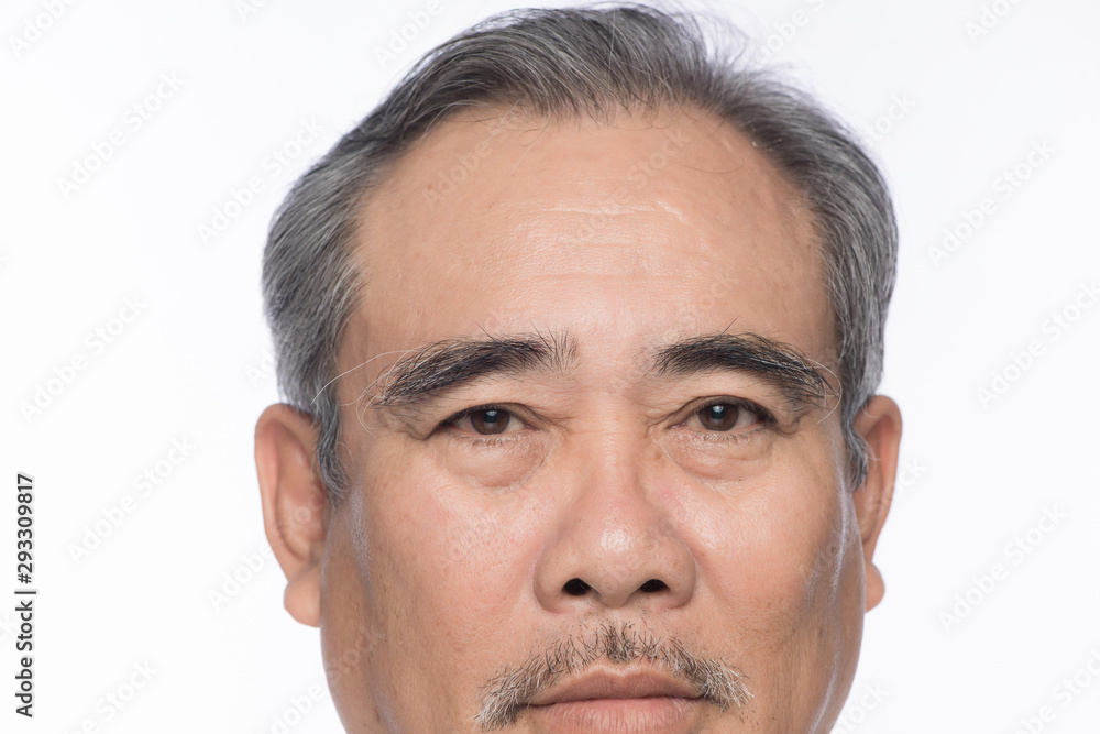 Fototapeta premium Face of elderly man looking at camera.
