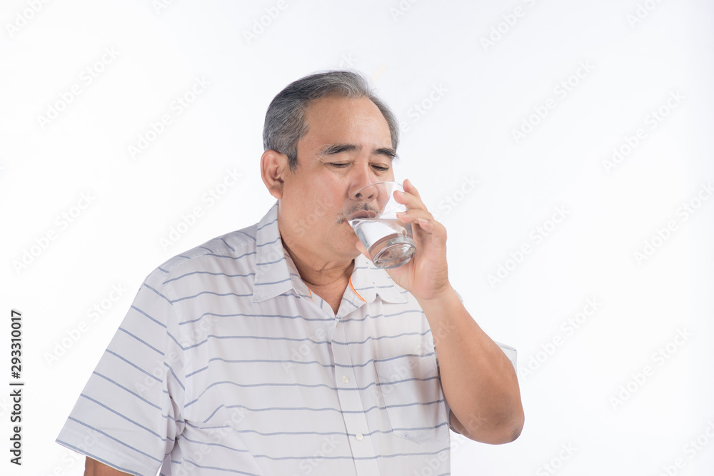 Asian Senior man drinking water. Elderly male holding transparent glass in his hand. Asian Senior man drinking water. Elderly male holding transparent glass in his hand.