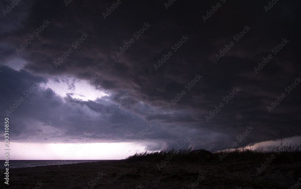 Gorgeous photo of the storm clouds passing by the beach of the sea of Azov Gorgeous photo of the storm clouds passing by the beach of the sea of Azov