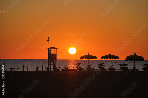 Sunrise on the beach in the background beach chairs on the beach