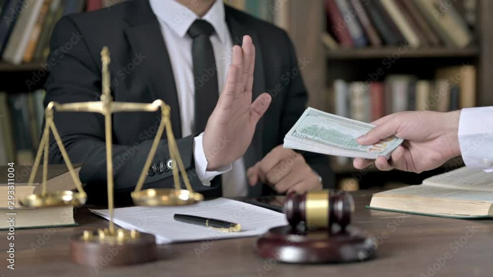 Close up Shoot of Judge Hand sign saying No to Money offered Close up Shoot of Judge Hand sign saying No to Money offered