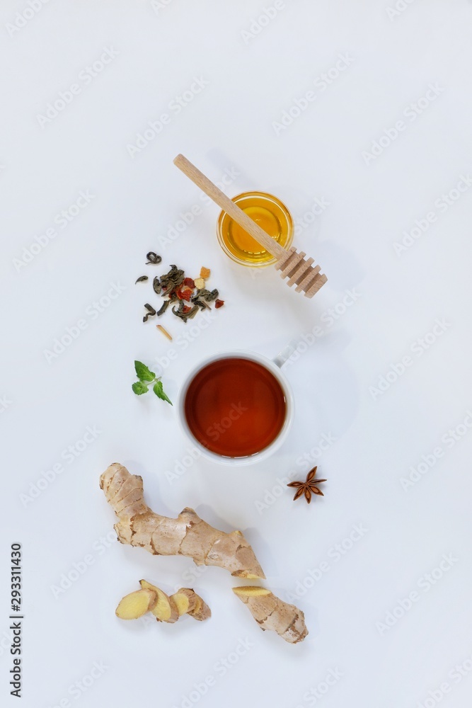 Fototapeta premium Ingredients for herbal ginger tea with honey, star anise and anise. Healthy food detox concept. Flat lay with space for text. Top view.