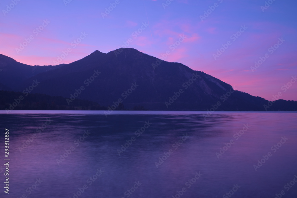 Sunrise over a lake in the Alps