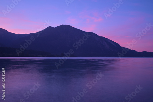 Sunrise over a lake in the Alps