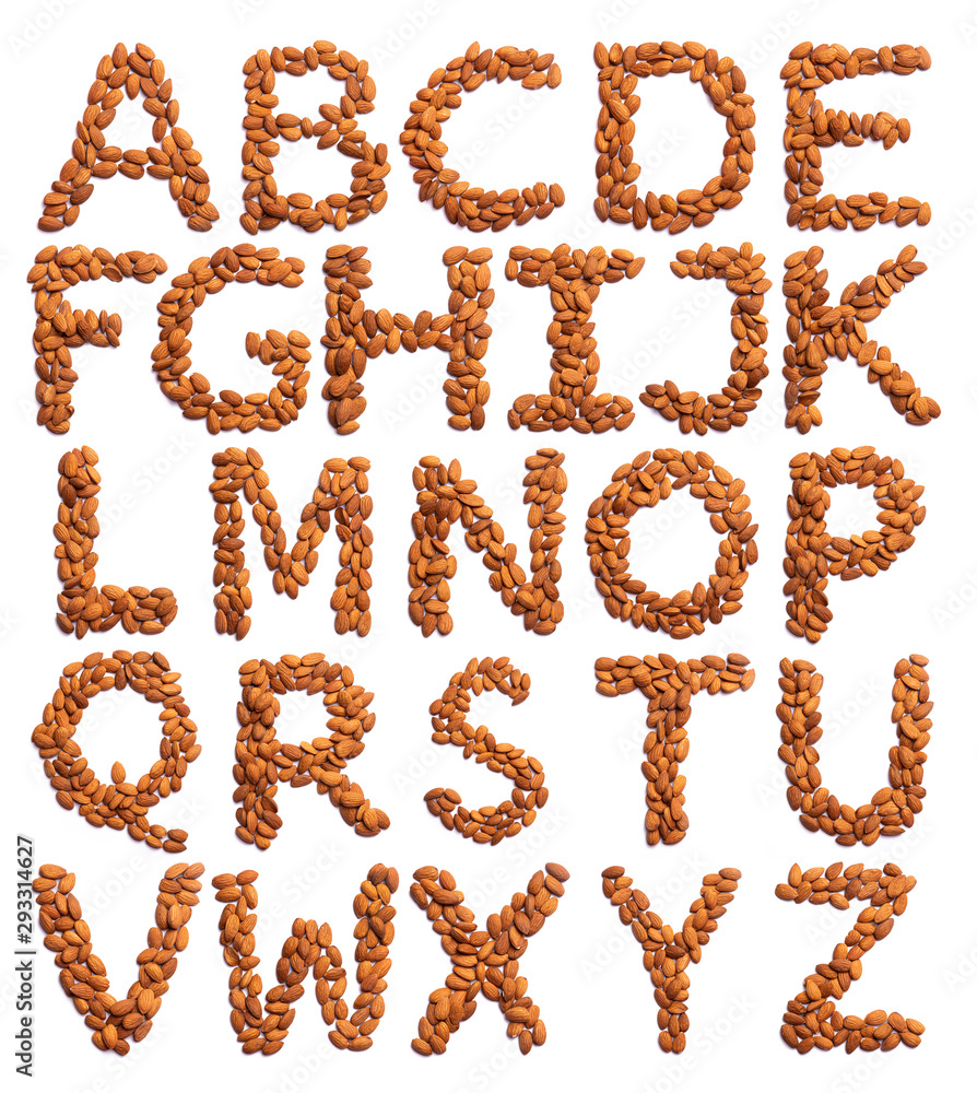 English alphabet from a peeled almond on a white isolated background. Peeled almond pattern. healthy food concept English alphabet from a peeled almond on a white isolated background. Peeled almond pattern. healthy food concept