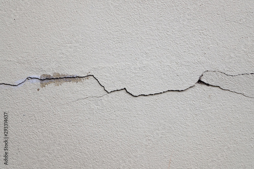 The clack was appeare on white concrete background, Cement wallpaper