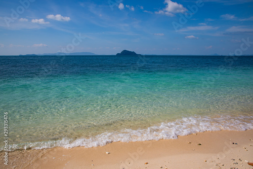 View of the turquoise water beach with light sand