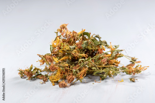  pile of dried hypericum on a wooden table