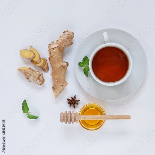 Ingredients for herbal ginger tea with honey, star anise and anise. Healthy food detox concept. Flat lay with space for text. Top view.