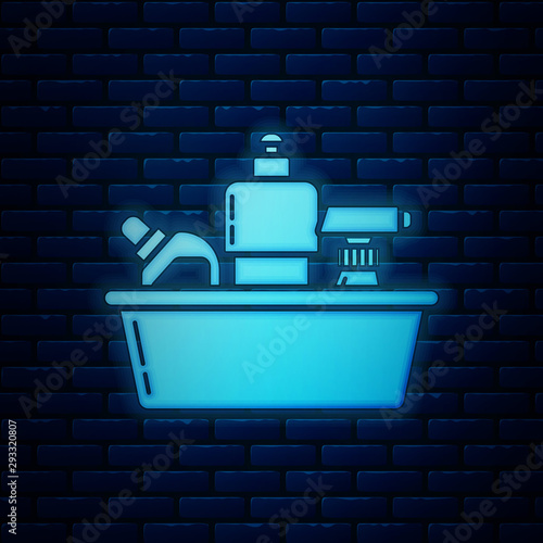 Glowing neon Plastic bottles for liquid laundry detergent, bleach, dishwashing liquid or another cleaning agent icon isolated on brick wall background. Vector Illustration