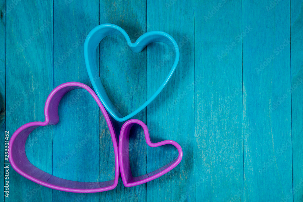 Heart-shaped figures on blue background