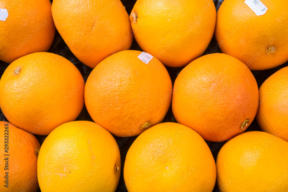 Organic oranges background on market Organic oranges background on market