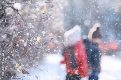 Kids walk in the park first snow