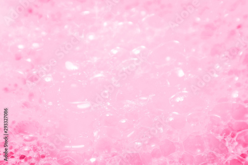 Beautiful abstract texture color white and pink bubbles background in water on pink background pattern clear soapy shiny