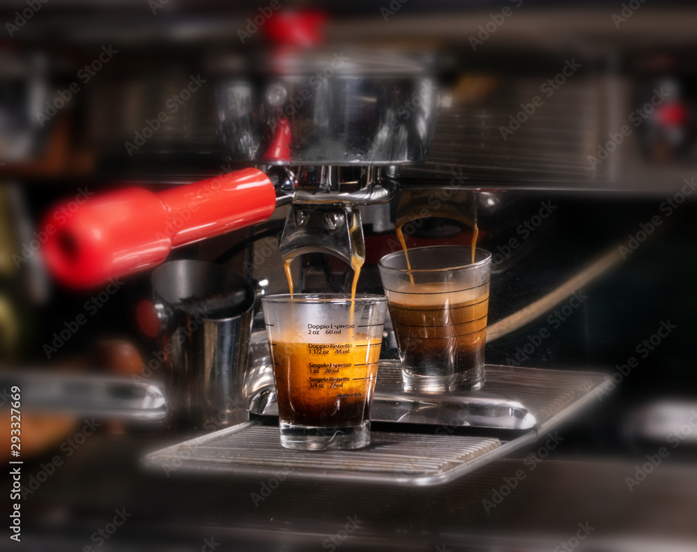 Making espresso in white mug in coffeeshop or cafe closeup