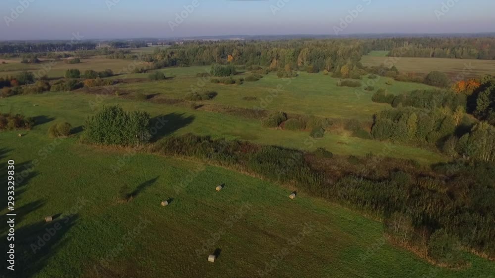 Hay Bales In A Field On A Sunny Autumn Morning, Aerial Dolly-In Footage Hay Bales In A Field On A Sunny Autumn Morning, Aerial Dolly-In Footage